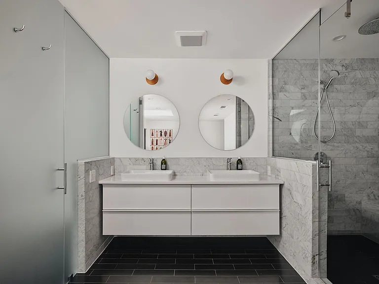 Enormous walk-in shower and high end Toto toilet systems.