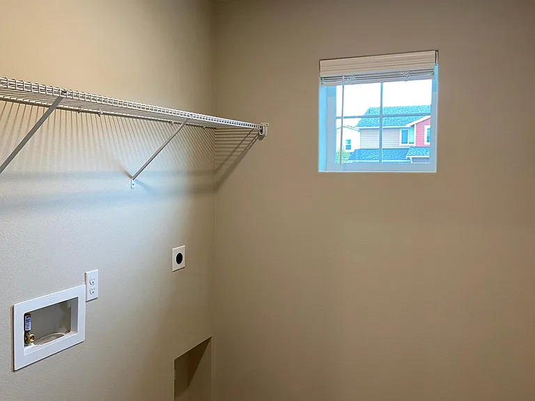 Laundry Room (Has front loading Samsung Washer & Dryer- New installed last year)