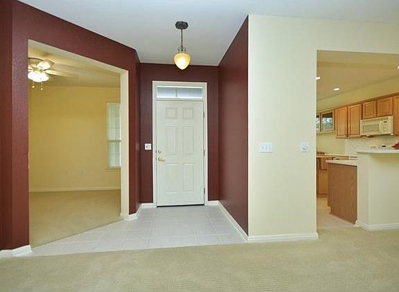 Off the Foyer, a Study/Computer Room offers corner windows viewing the Front Courtyard.