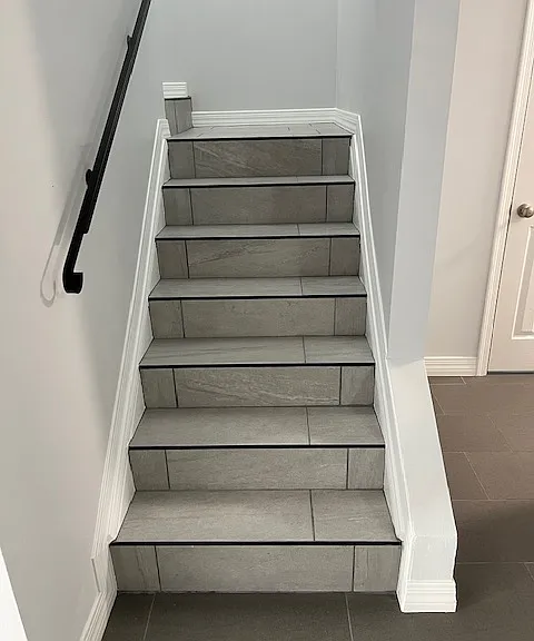 Stairwell, Brand New Tile and Grout, New Baseboard and Molding, Handrails, Chandelier Light. Freshly Painted Ceiling, Walls, Baseboards and Moldings.