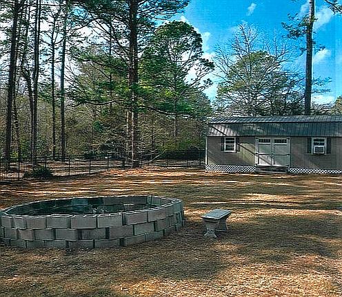 fire pit and storage bldg