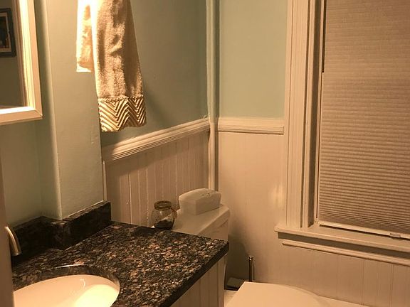 Downstairs bathroom with slate tile floor, granite counterto