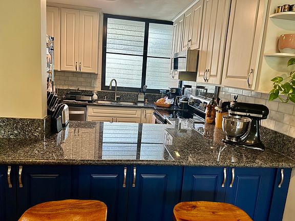 Kitchen counter with bar seating.