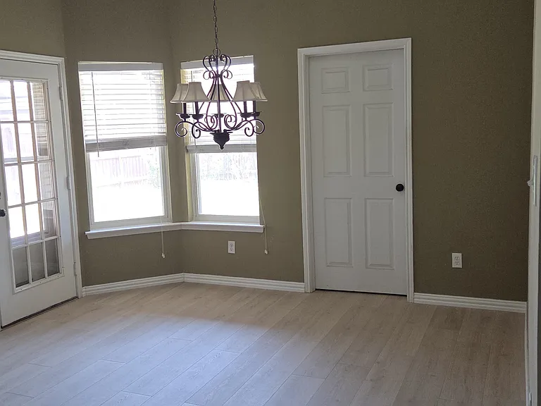Breakfast nook leading to patio and laundry room