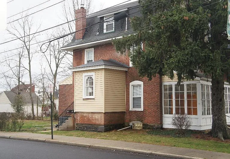 Side view of house where apartment entry is located.