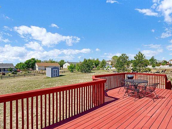 Terrific wood deck to enjoy our Colorado sunshine and even a peak at Pikes Peak!