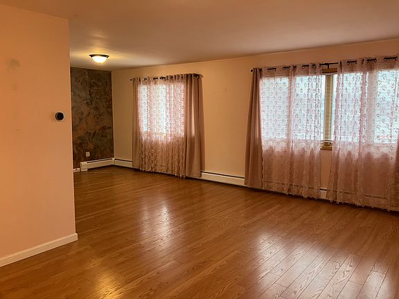 (Living room) in front of house. Apartment is being fully painted.