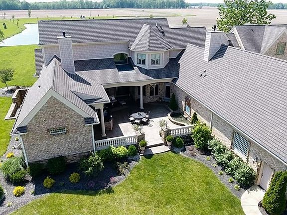 Beautifully landscaped, partially covered patio with fountain