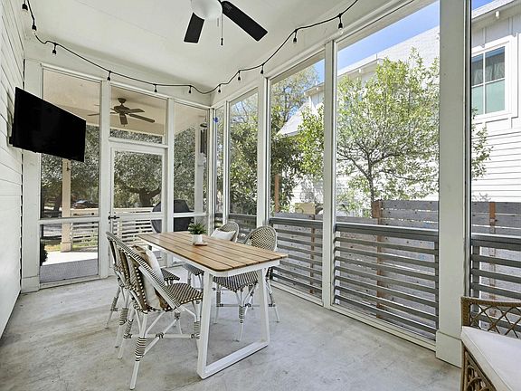 Screened in porch with mounted smart TV