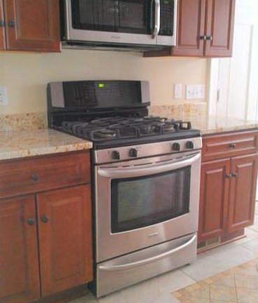 Gas convection range, over the range microwave and exhaust