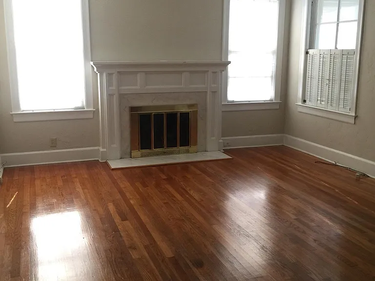living room--has upright piano and celling fan