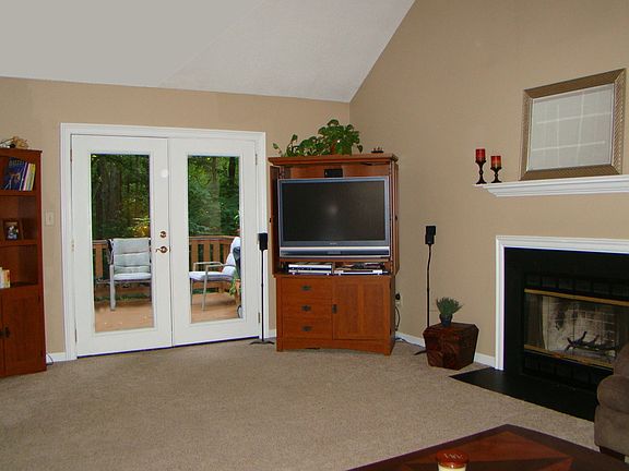 Family Room w/ Vaulted Ceiling and Fireplace