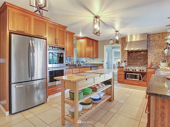The kitchen! Stainless appliances throughout, beautiful tile floors.