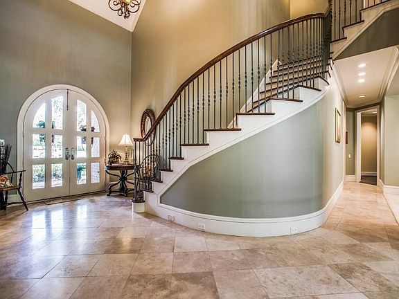 The dramatic entrance is the perfect first impression as you enter this beautiful custom home.