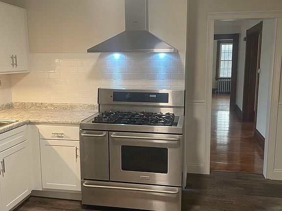 Kitchen view coming from back porch entry to unit.
