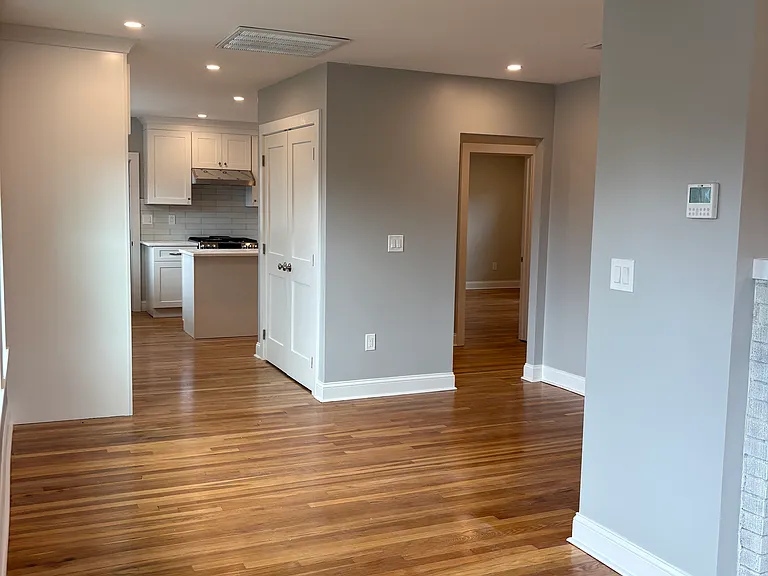 Dining Room - Refinished hardwood floors, new windows, new insulation, new sheetrock, and new electrical.