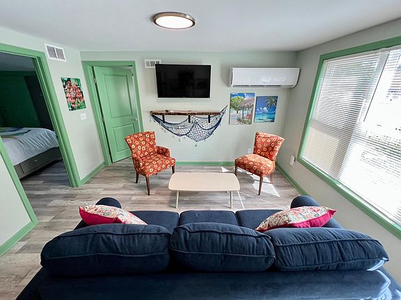 Large living room with queen sleeper couch