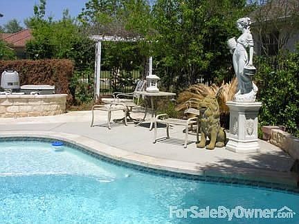 Salt water swimming pool
						:
						Has waterfall and jetted, heated hot pool.