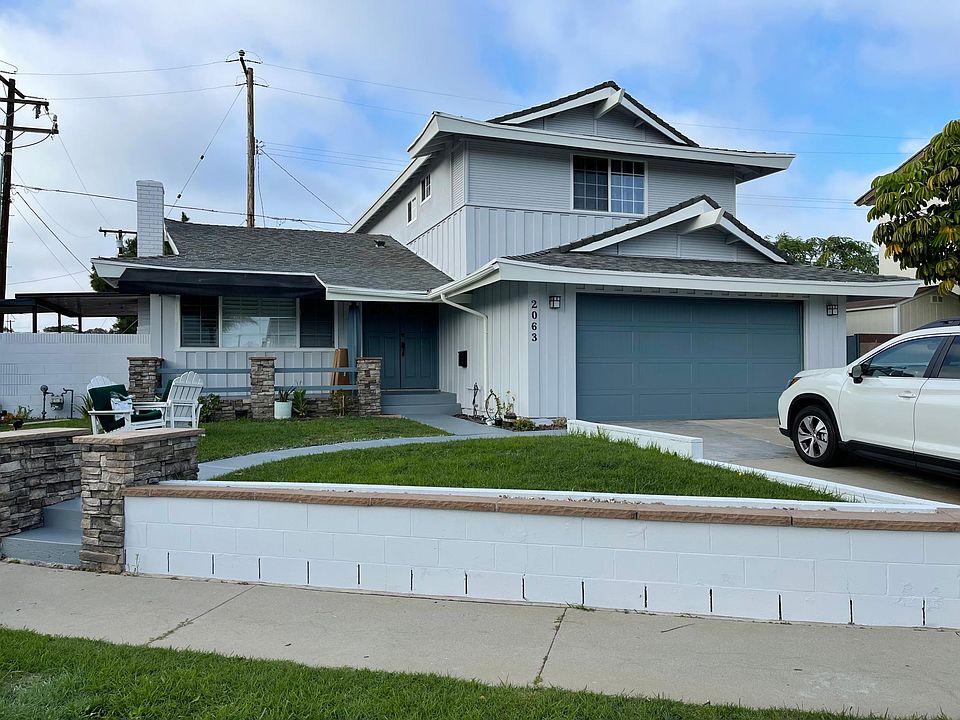 Street View of House, Front Porch, Yard and Oversized Double Garage
