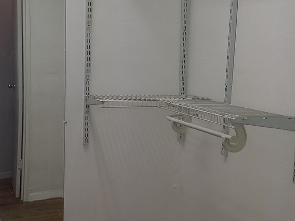 Walk in closet in hallway