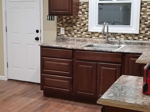Kitchen and door to balcony and exit