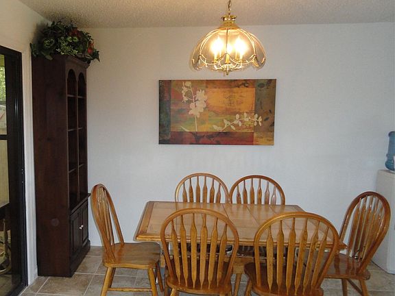 Dining room off the kitchen, tile floors throughout 
