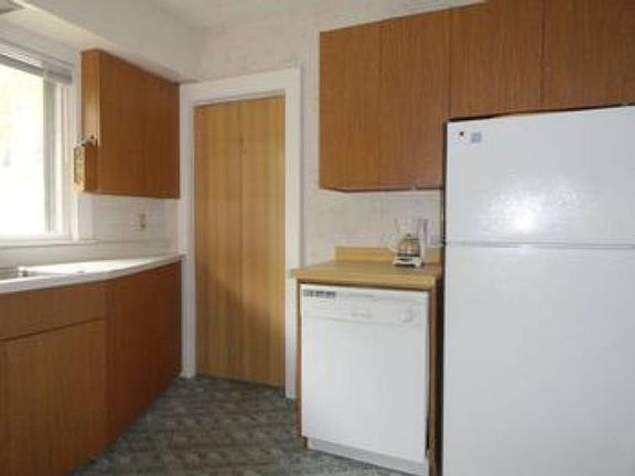 The kitchen has a door leading to a little mud room area and the side entrance, where you can enter and head to the full basement too! All of the appliances are included and will stay for the new owners!