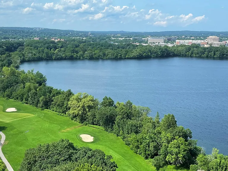Scenic and unbuildable water and golf-course view out the window of Parkside Place, apartments in Cambridge MA with onsite garage parking