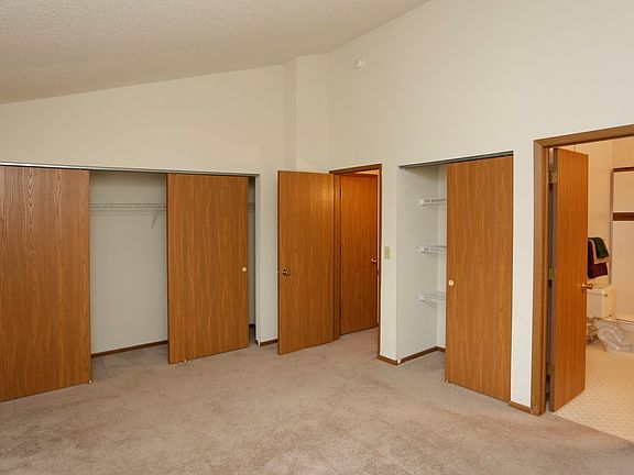 King-sized Master Bedroom with Wall to Wall Closets and Vaul