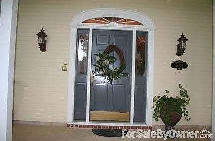 Front entrance : Welcome! Inviting front porch with recessed lighting and swing