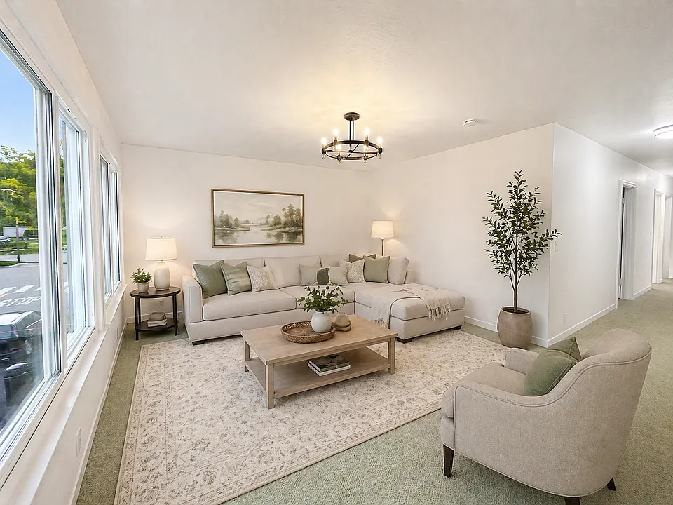 Large lightfulled living room with new carpet - Virtually Staged