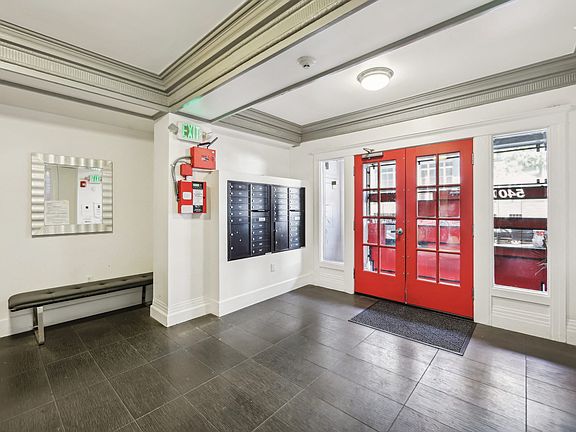 Apartment foyer with stylish decor and mailboxes