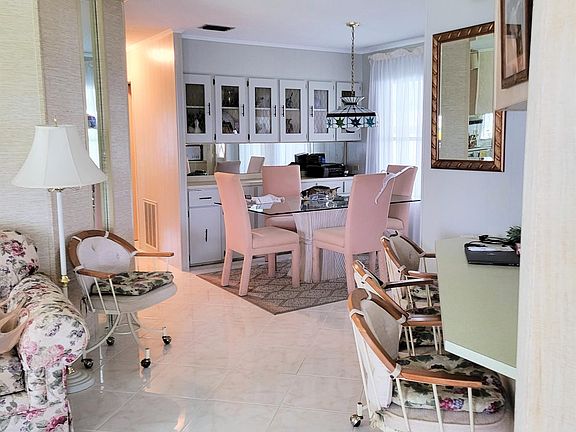View from living room to dining room and eat in kitchen counter