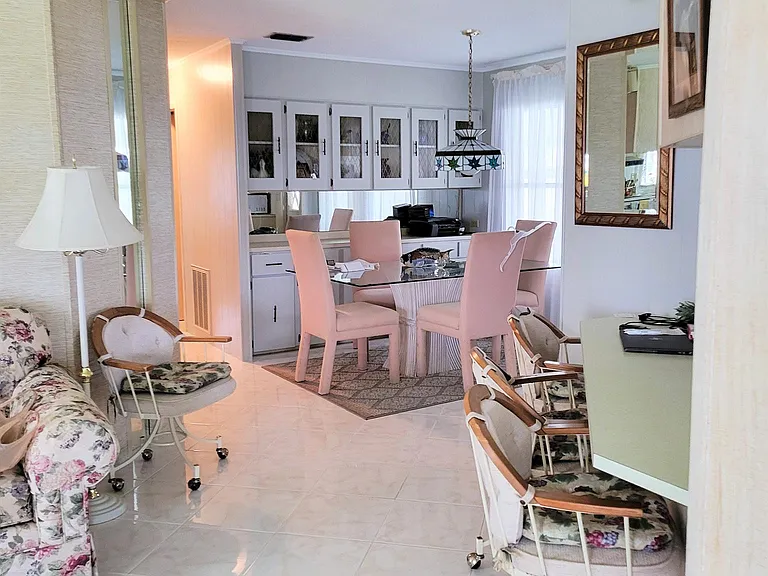 View from living room to dining room and eat in kitchen counter
