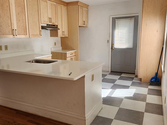 THIS IS THE BRAND NEW KITCHEN. New cabinets, floor, quartz countertop. Includes pantry cabinet with roll-out shelves. Faucet and all of the appliances are new this year and will be in place before you move in.
