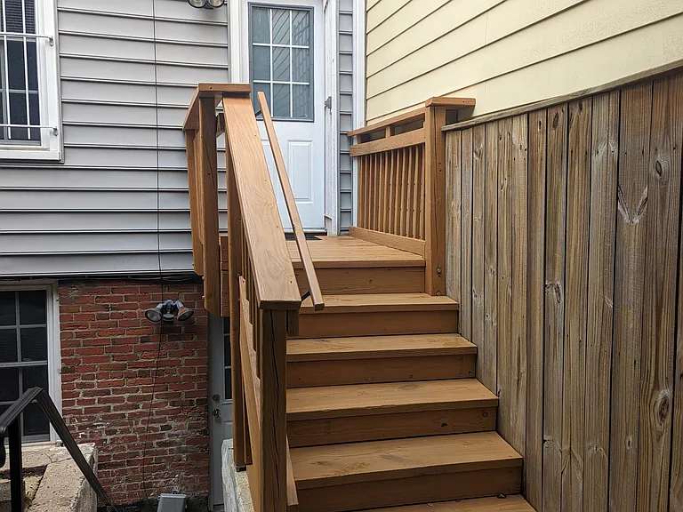 Steps to backyard patio and secure parking