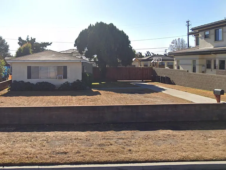 Street view. North facing house for optimal sunlight delivery while staying cooler during summer months.
