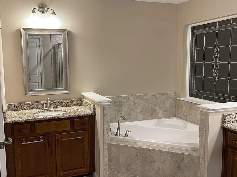 Second Floor Master bath with separate sinks + bath tub