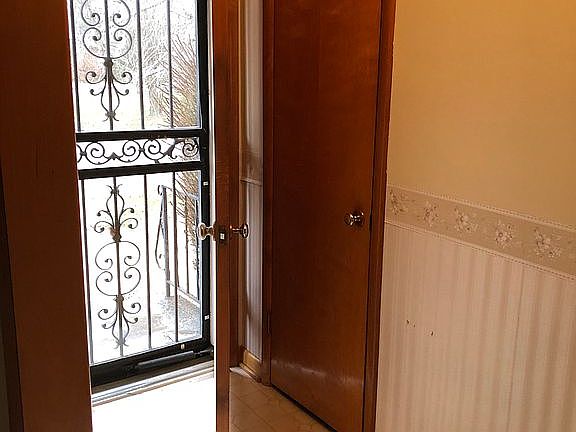 Front door and coat closet 