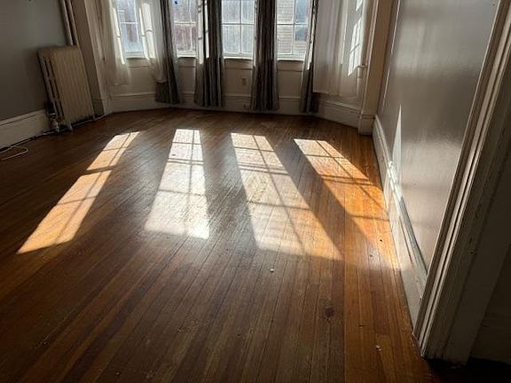 Wonderful hardwood floors engulfed by glorious sunlight!