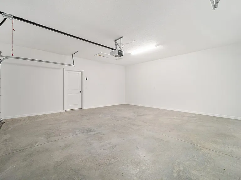 Double car garage with plenty of room for car and golf cart