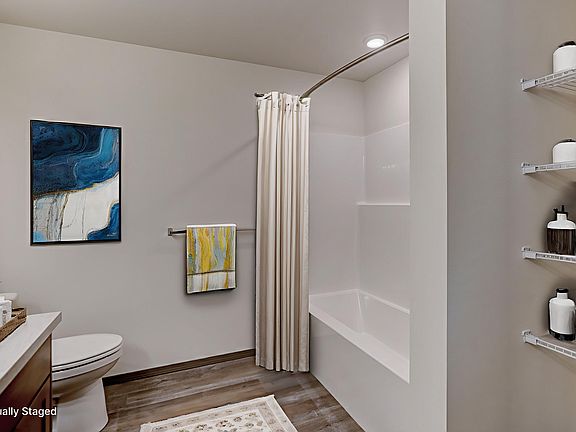 Large tub/shower and storage space in the bathroom