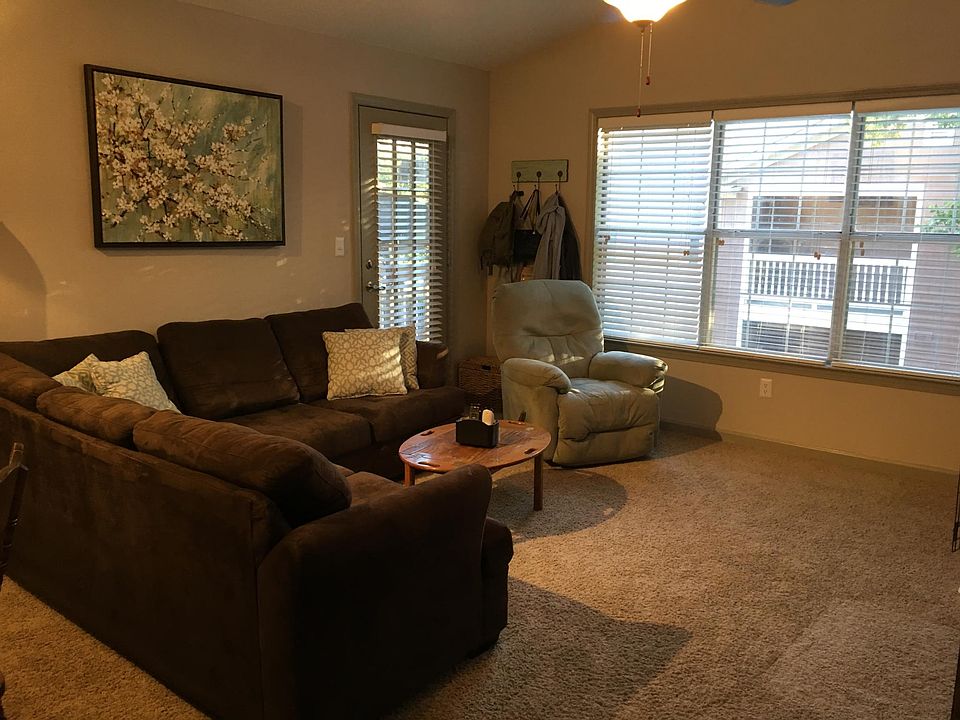 vaulted ceilings and huge window bringing in lots of natural
