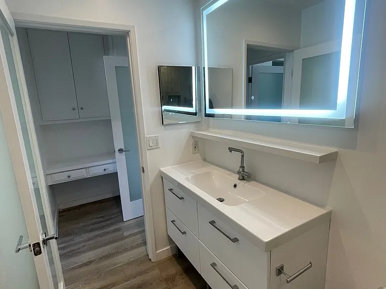 Large bathroom with LED mirror
