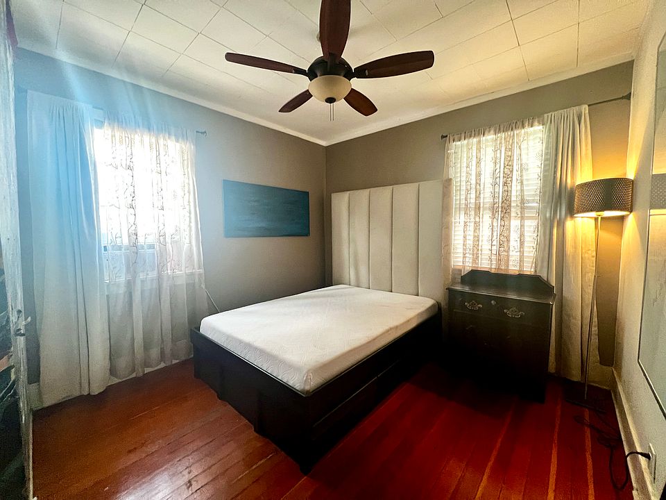 Private bedroom with 2 windows, AC unit, and closet. Includes full-size platform bed with foam mattress + 6 drawers (or unfurnished, if preferred). Lamp, side dresser. Sheer curtains + black out curtains.