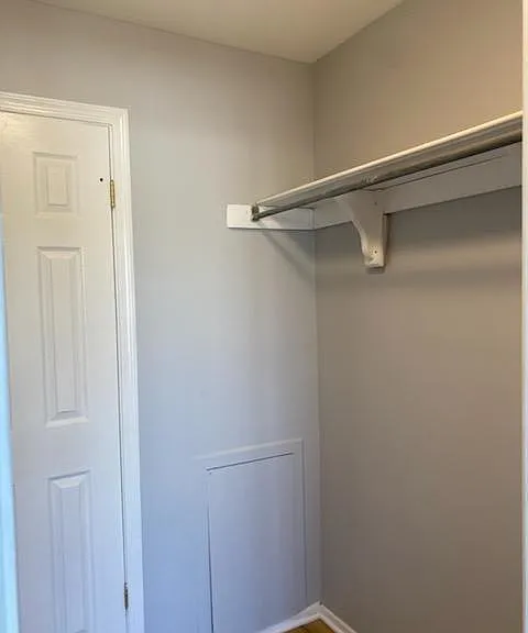 Master closet. Second hanger rod on left side of closet. Door leads to full bath.