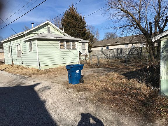 Back of house with off street parking & fenced yard