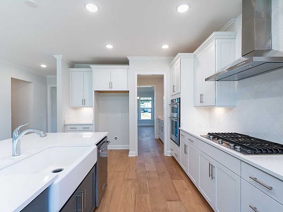 Beautiful Kitchen features wall ovens and plenty of cabinet space.