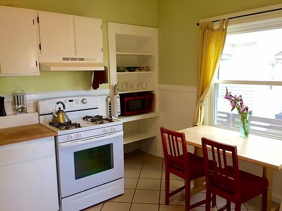 Kitchen, gas stove, ceramic tile floor, built in shelves, ne