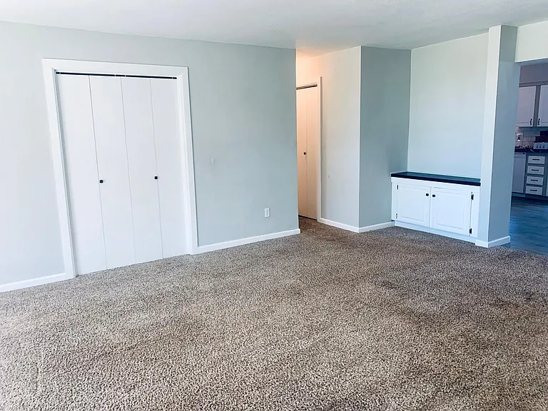 Family room closet, storage nook, and hallway.